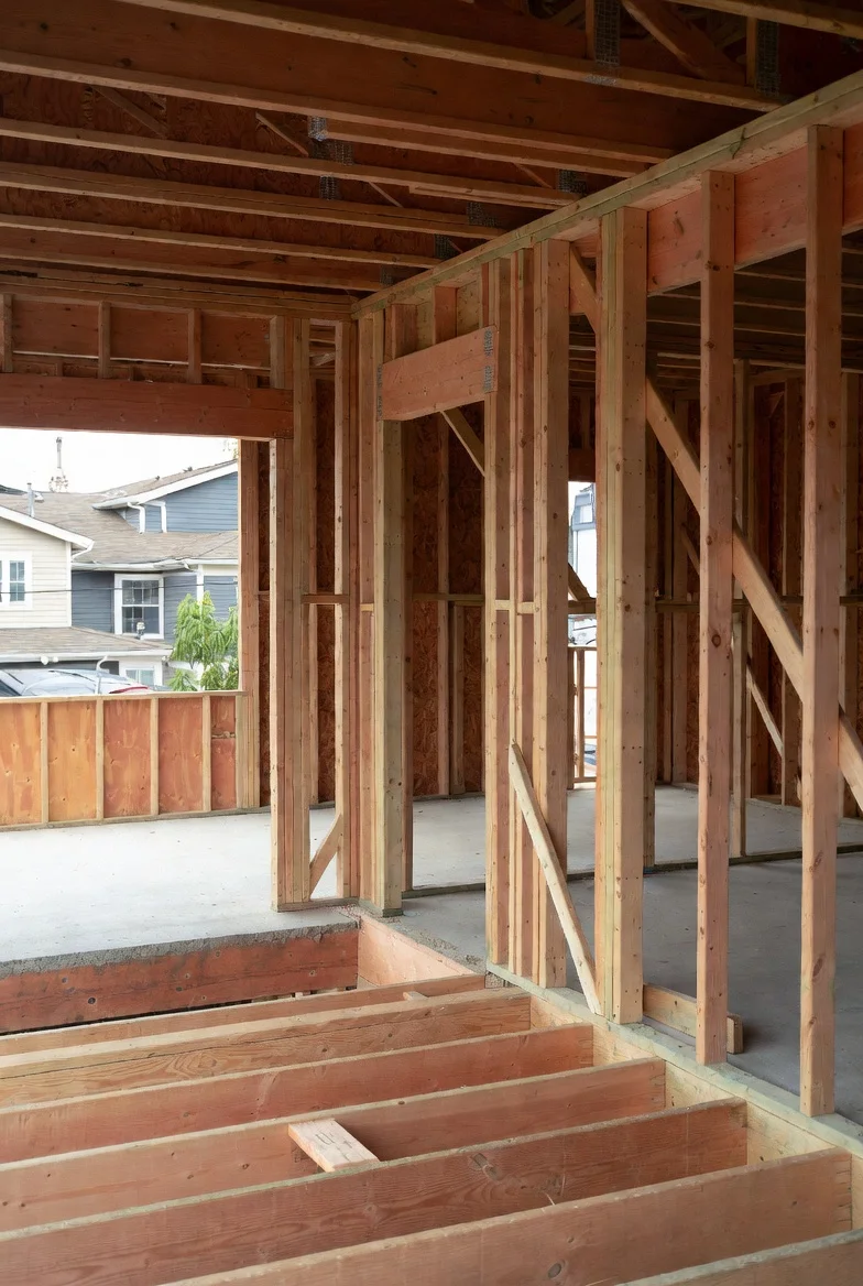 CMHC multi-unit construction — rough framing of two-unit residential